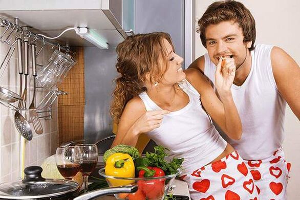 a woman feeds a man with products for potency